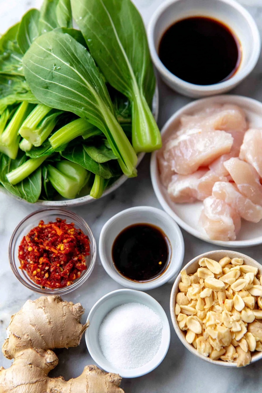Flat lay of a fresh 1-inch knob of peeled ginger, six whole garlic cloves with skins on, a small white ceramic bowl of dark soy sauce, a small white ceramic bowl of clear rice vinegar, a small white ceramic bowl of golden toasted sesame oil, a small white ceramic bowl of white granulated sugar, a small white ceramic bowl of pale cornstarch powder, a small white ceramic bowl of deep red chili paste, thin sliced raw boneless chicken breast strips arranged neatly, one medium red onion cut into ½-inch chunks, bright green roughly chopped baby bok choy leaves and stems, a small white ceramic bowl of crushed dry-roasted peanuts, and a small bunch of fresh emerald green Thai basil leaves, all ingredients fresh and natural, perfect symmetry and balanced layout, placed on a clean white marble surface, soft natural light, photo taken with an iPhone, professional food photography style, fresh ingredients, white ceramic bowls, no bottles, no duplicates, no utensils, no packaging --ar 2:3 --v 7 --p m7354615311229779997
