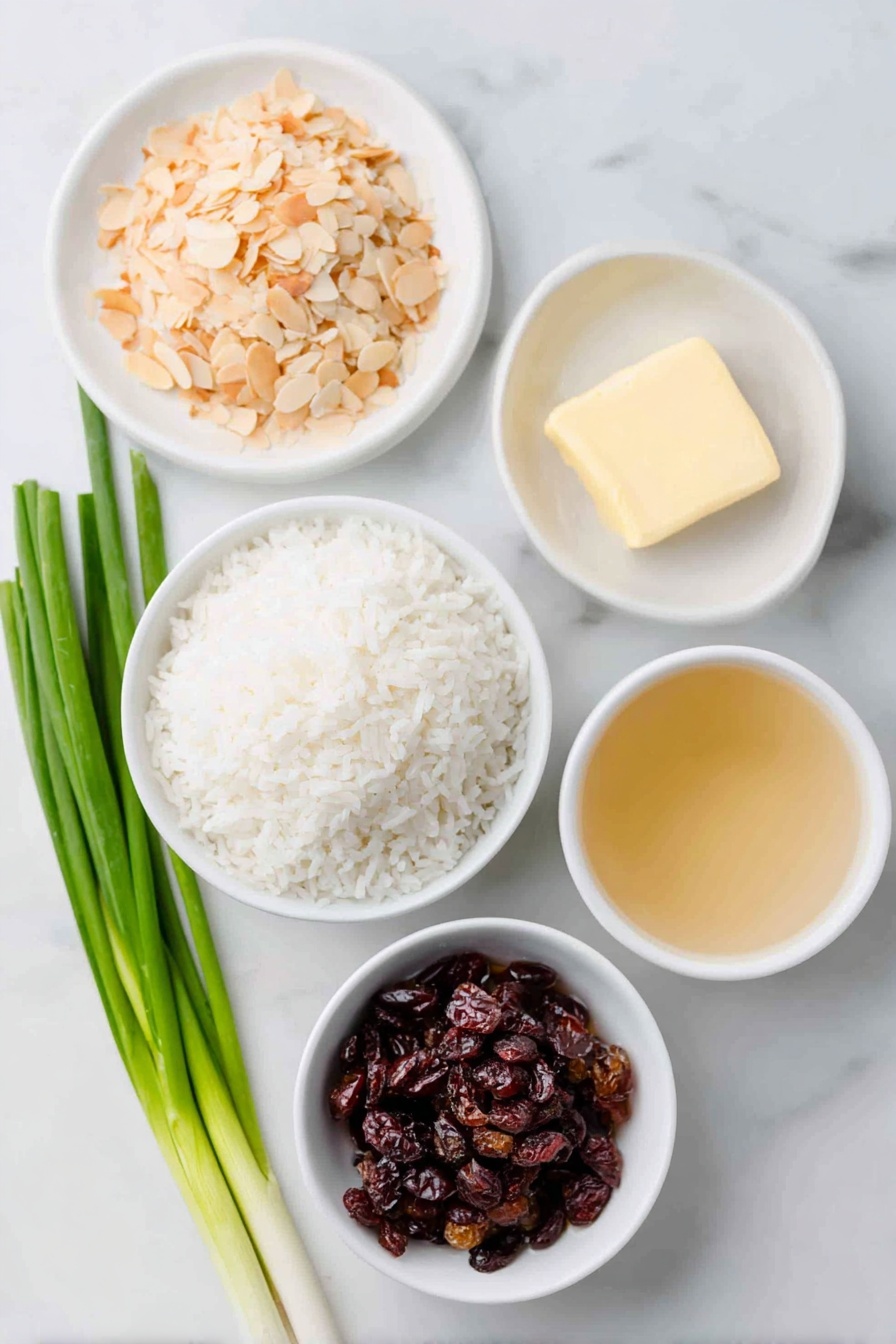 Flat lay of slivered almonds lightly toasted in a small pile, a small pat of butter on a white ceramic plate, a mound of converted white rice, a small bunch of green onions with a few sliced rounds beside them, a small white bowl of clear chicken stock, a small white bowl of water, and a small white bowl filled with plump dried cranberries, all arranged with perfect symmetry and balanced proportions, placed on a clean white marble surface, soft natural light, photo taken with an iPhone, professional food photography style, fresh ingredients, white ceramic bowls, no bottles, no duplicates, no utensils, no packaging --ar 2:3 --v 7 --p m7354615311229779997
